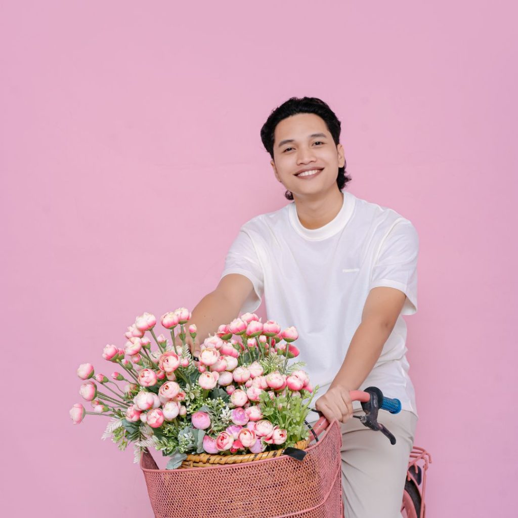 Kian Kian on bike with pink flowers